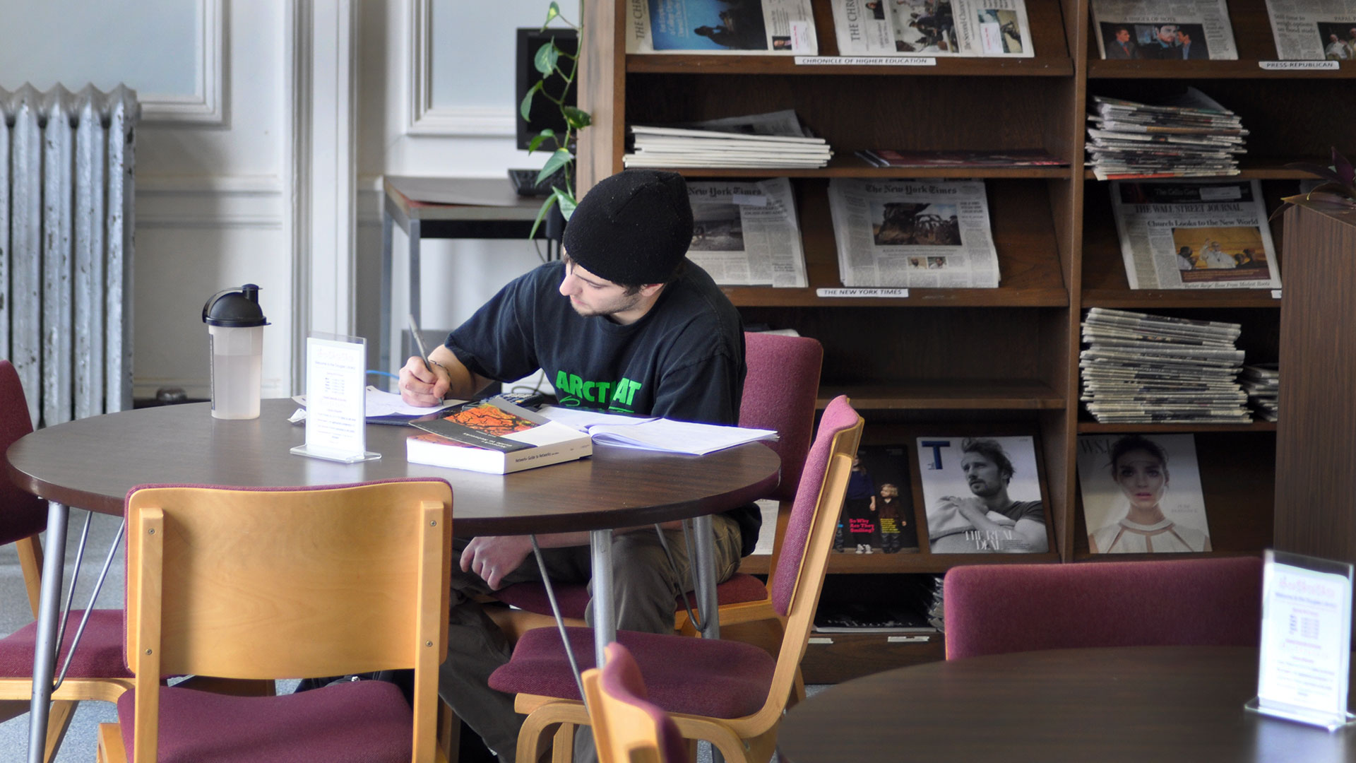 Student studying at a table