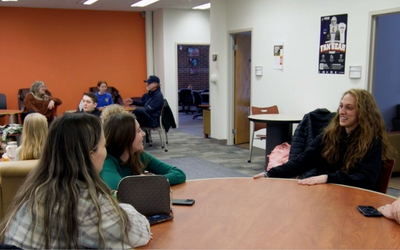Several people sitting and having conversations with each other