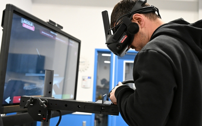 A person using a virtual reality welding tool