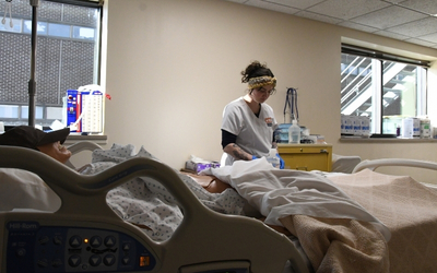 A nursing student in a nursing lab